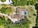 Overhead view of home showing pool, roof, and circular drive at 296 Pine Ranch Trl, Osprey, FL 34229