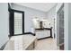 Bathroom featuring a double sink vanity and tiled bathtub at 296 Pine Ranch Trl, Osprey, FL 34229