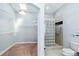 Bathroom showing closet with shelving and walk-in glass block shower at 296 Pine Ranch Trl, Osprey, FL 34229