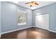 Bedroom with hardwood flooring, closet, and window at 296 Pine Ranch Trl, Osprey, FL 34229
