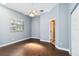 Bedroom features hardwood floors, window and closet at 296 Pine Ranch Trl, Osprey, FL 34229