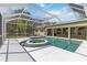 This screen-enclosed pool includes a spa at 296 Pine Ranch Trl, Osprey, FL 34229