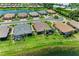 Aerial view of house in an upscale community with a pond and manicured lawns at 3027 Formia Ct, Lakewood Ranch, FL 34211