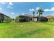 Well-maintained backyard featuring tropical landscaping with screened-in patio and relaxing outdoor space at 3027 Formia Ct, Lakewood Ranch, FL 34211