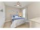 Cozy bedroom with neutral tones, ceiling fan, and coordinated bedding, creating a tranquil and inviting space at 3027 Formia Ct, Lakewood Ranch, FL 34211