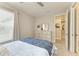Comfortable bedroom featuring a large dresser, natural light, and cozy bedding, creating a relaxing retreat at 3027 Formia Ct, Lakewood Ranch, FL 34211