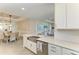 Kitchen area shows stainless steel appliances, white cabinets and an undermount stainless steel sink at 3027 Formia Ct, Lakewood Ranch, FL 34211