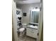 Traditional bathroom featuring tiled floors, single vanity, and a shower-tub combo at 3287 Rackley Rd, Brooksville, FL 34604