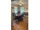 Traditional dining room featuring wood floors, and wainscoting walls at 3287 Rackley Rd, Brooksville, FL 34604