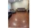 Spacious living room features wood-look flooring, abundant seating, and natural light at 3287 Rackley Rd, Brooksville, FL 34604