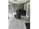 Enclosed porch with wicker seating and neutral toned flooring, perfect for relaxing at 3287 Rackley Rd, Brooksville, FL 34604
