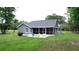 Backyard screened porch with outdoor seating, offering a tranquil and relaxing atmosphere at 3287 Rackley Rd, Brooksville, FL 34604