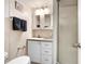 Bathroom with a walk-in shower, white vanity, and well-lit mirror at 3333 26Th E Ave # 1104, Bradenton, FL 34208