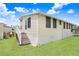 Well maintained, light yellow single-story home with green lawn and trimmed shrubbery at 3333 26Th E Ave # 1104, Bradenton, FL 34208