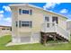 Charming single-story home with light yellow siding, white trim and manicured green lawn at 3333 26Th E Ave # 1104, Bradenton, FL 34208
