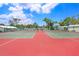 Well maintained community tennis courts surrounded by lush trees and blue skies at 3333 26Th E Ave # 1104, Bradenton, FL 34208