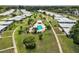 Aerial view of homes with a community pool and lawns at 3649 Somerville Dr # 1507, Sarasota, FL 34232