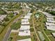 Panoramic view displays this community's layout with neatly arranged homes, green spaces, and community pool at 3649 Somerville Dr # 1507, Sarasota, FL 34232