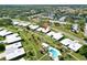 Aerial view of neighborhood featuring lawns and a pool at 3649 Somerville Dr # 1507, Sarasota, FL 34232