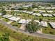 Birds-eye view of the community features lovely landscaping, mature trees, and a community pool for relaxation at 3649 Somerville Dr # 1507, Sarasota, FL 34232