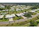 This aerial view displays the tranquil neighborhood with manicured lawns and mature trees giving a park-like setting at 3649 Somerville Dr # 1507, Sarasota, FL 34232