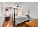 Comfortable bedroom with a four poster bed, and a ceiling fan at 3649 Somerville Dr # 1507, Sarasota, FL 34232
