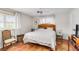 Bright bedroom features a neutral color palette, terracotta tile and natural light at 3649 Somerville Dr # 1507, Sarasota, FL 34232