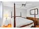 Spacious bedroom with a four poster bed, tile flooring and ample natural light at 3649 Somerville Dr # 1507, Sarasota, FL 34232