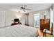 Cozy bedroom featuring tile flooring, a ceiling fan, and an ensuite bathroom at 3649 Somerville Dr # 1507, Sarasota, FL 34232