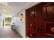 Welcoming front porch with a decorative front door and a side table at 3649 Somerville Dr # 1507, Sarasota, FL 34232