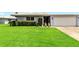 Well-maintained home featuring lush green lawn and manicured landscaping at 3649 Somerville Dr # 1507, Sarasota, FL 34232