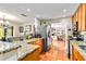 Modern kitchen with a breakfast bar, stainless steel appliances and warm wooden cabinets at 3649 Somerville Dr # 1507, Sarasota, FL 34232