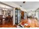 Open layout with dining room, living room, terracotta floors and display case at 3649 Somerville Dr # 1507, Sarasota, FL 34232