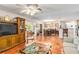 Bright and open living area with tile flooring flowing into the dining room at 3649 Somerville Dr # 1507, Sarasota, FL 34232