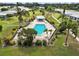 Aerial view of a community pool with lounge chairs and a gazebo at 3649 Somerville Dr # 1507, Sarasota, FL 34232
