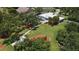 Expansive property features lush greenery, a private pool, and meticulously landscaped gardens at 3764 Oak Grove Dr, Sarasota, FL 34243