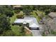 Sprawling residence with manicured landscaping, complemented by a pristine pool and a well-maintained exterior, embodying luxury living at 3764 Oak Grove Dr, Sarasota, FL 34243