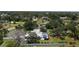 Aerial view of house featuring large backyard, mature trees, lanai and pool at 3764 Oak Grove Dr, Sarasota, FL 34243