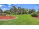 Expansive backyard with mature trees and manicured landscaping at 3764 Oak Grove Dr, Sarasota, FL 34243