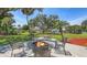 Backyard patio with fire pit and ample seating; perfect for entertaining at 3764 Oak Grove Dr, Sarasota, FL 34243