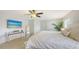 Serene bedroom with beach-themed decor and light wood-look floors at 3764 Oak Grove Dr, Sarasota, FL 34243