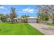 Well-maintained home with attached garage and manicured landscaping at 3764 Oak Grove Dr, Sarasota, FL 34243