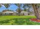 Charming single-story home with a well-manicured front lawn and attached two-car garage at 3764 Oak Grove Dr, Sarasota, FL 34243