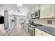 Well-lit kitchen featuring stainless steel appliances and a cozy breakfast nook at 3764 Oak Grove Dr, Sarasota, FL 34243