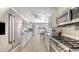 Bright kitchen with stainless steel appliances, breakfast nook with backyard view at 3764 Oak Grove Dr, Sarasota, FL 34243