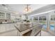 Bright kitchen featuring a breakfast nook overlooking the pool and backyard at 3764 Oak Grove Dr, Sarasota, FL 34243