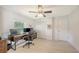 Well-lit home office featuring a large desk and ample natural light at 3764 Oak Grove Dr, Sarasota, FL 34243