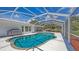 Sparkling pool with a screened enclosure, providing a relaxing and private outdoor oasis with ample deck space at 3764 Oak Grove Dr, Sarasota, FL 34243
