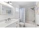 Updated bathroom with marble-tiled shower, granite counter tops, and updated fixtures at 3978 Overlook Bend Ter # 25, Sarasota, FL 34232