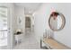 Inviting hallway with stylish decor, marble tile flooring, leading to various rooms in the home at 3978 Overlook Bend Ter # 25, Sarasota, FL 34232